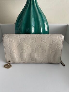 Gucci Ivory Embossed GG Continental Wallet with Gold Charm